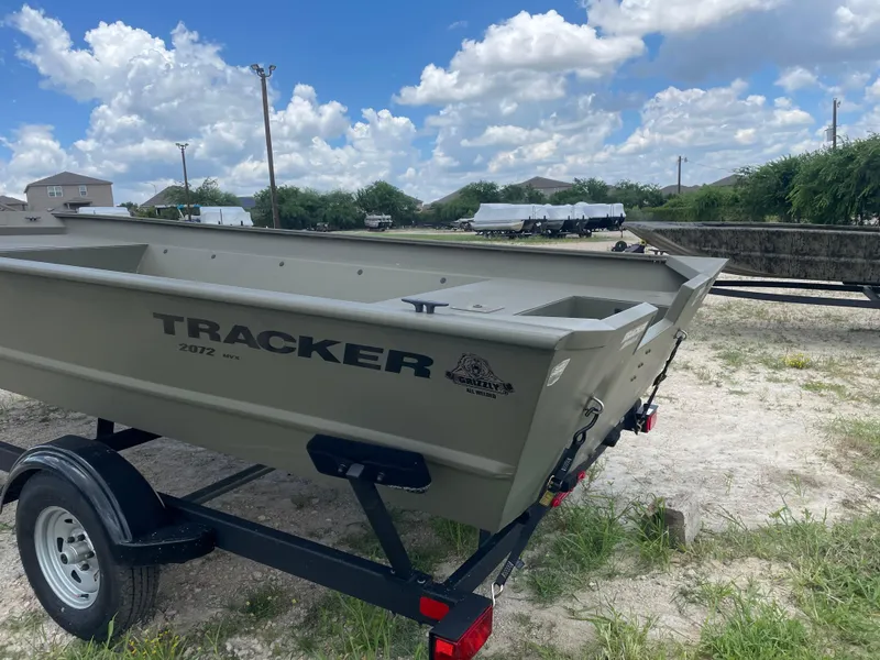 Slide: The Image of 2025 Tracker GRIZZLY 2072 Utility boat on trailer under a blue sky. - 4