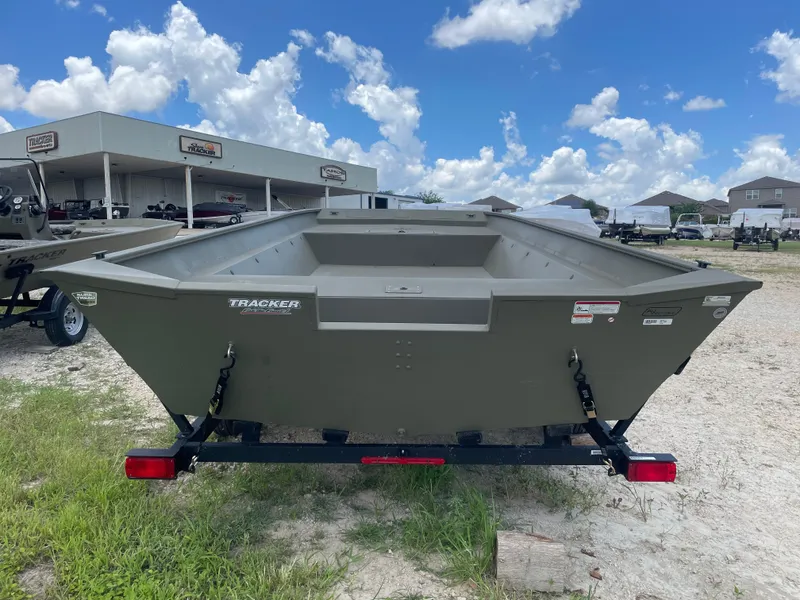 Slide: The Image of 2025 Tracker GRIZZLY 2072 Utility boat on trailer, displayed outdoors under a blue sky. - 5