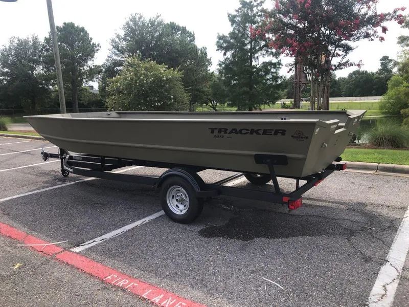 Slide: The Image of 2025 Tracker GRIZZLY 2072 Utility boat on trailer in parking lot. - 1