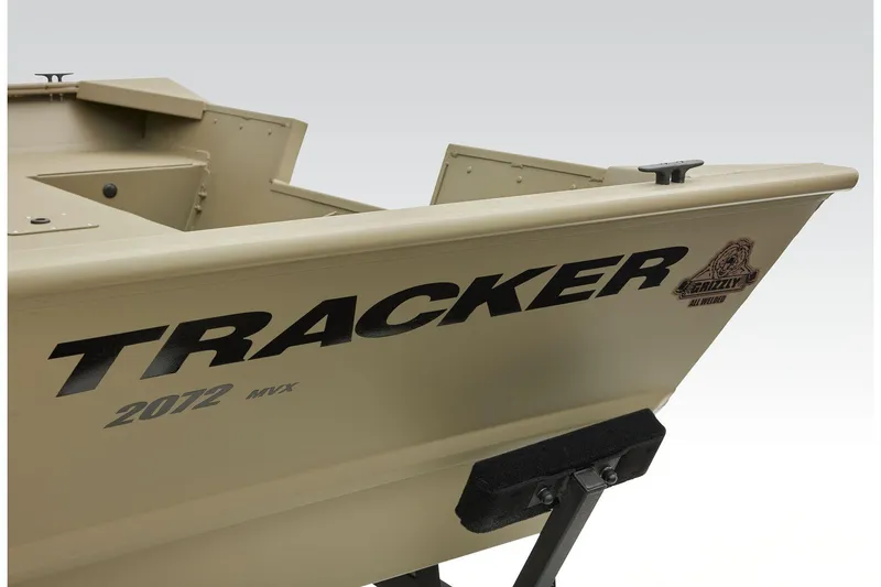 Slide: The Image of 2025 Tracker GRIZZLY 2072 Utility boat, beige color, partial side view. - 24