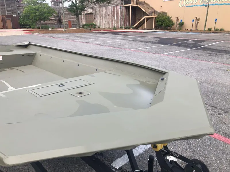 Slide: The Image of 2025 Tracker GRIZZLY 2072 Utility boat in a parking lot, showcasing its spacious interior. - 7