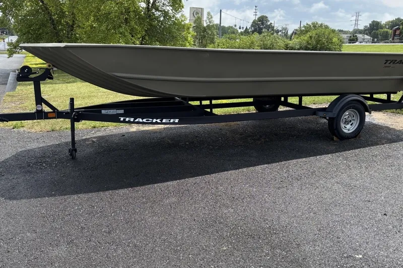 The Image of 2025 Tracker Grizzly 2072 Utility boat on trailer, parked outdoors. - 0