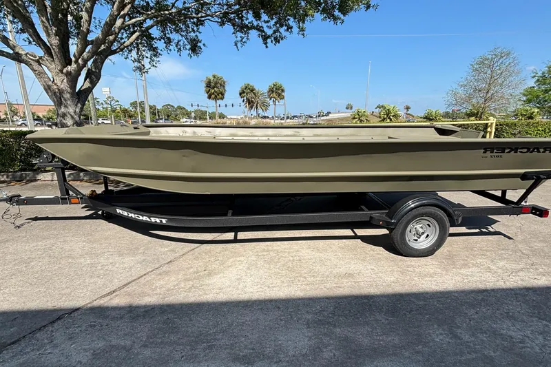 The Image of 2025 Tracker GRIZZLY 2072 Utility boat on trailer, parked outdoors. - 0