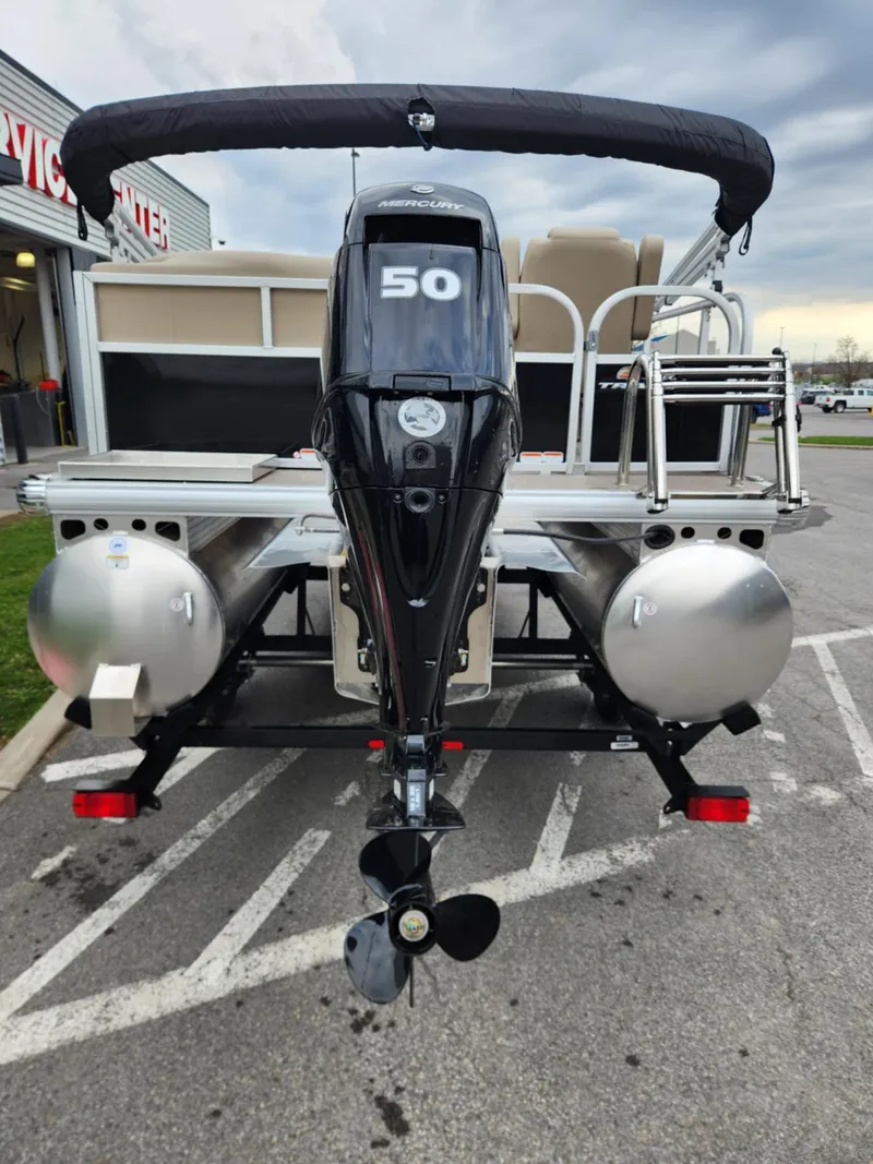 Slide: The Image of 2025 Sun Tracker Party Barge 16 DLX pontoon boat with 50 HP engine, rear view. - 7