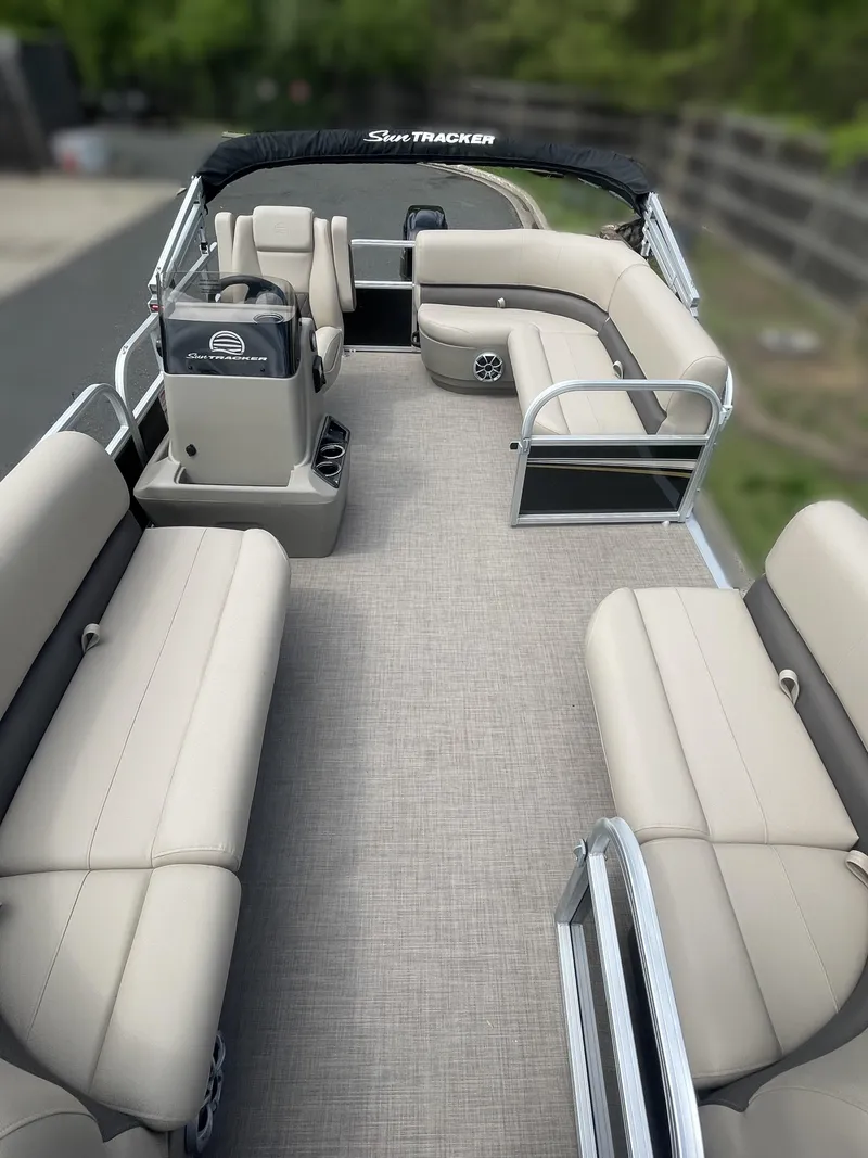 Slide: The Image of 2025 Sun Tracker Party Barge 16 DLX pontoon boat with spacious seating and modern design. - 3