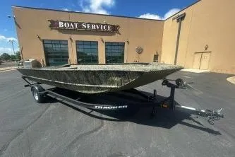 The Image of 2025 Tracker Grizzly 2072 Utility boat on trailer outside service center. - 0