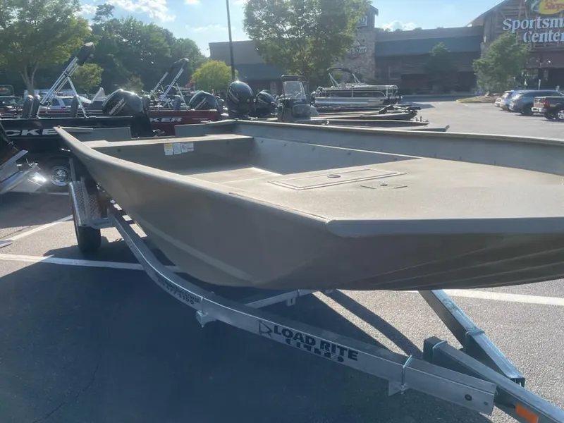 Slide: The Image of 2025 Tracker GRIZZLY 2072 Utility boat on Load Rite trailer in parking lot. - 2
