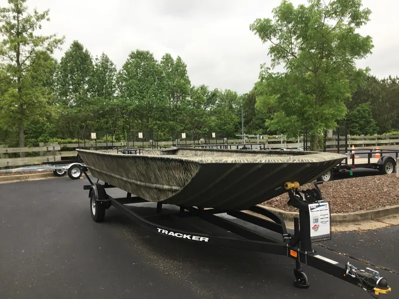Slide: The Image of 2025 Tracker GRIZZLY 2072 Utility boat on trailer in outdoor setting. - 2