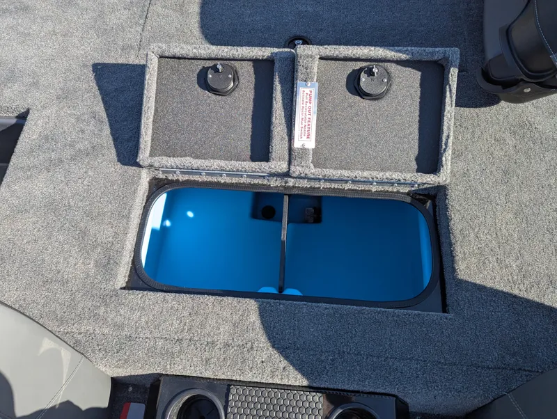 Slide: The Image of 2025 Tracker Savage 215 boat interior with open storage compartment. - 18