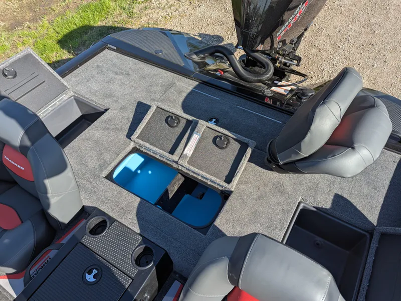 Slide: The Image of 2025 Tracker Savage 215 boat interior with seating and storage compartments. - 19