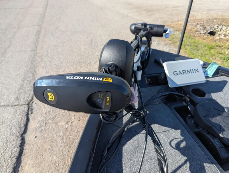 Slide: The Image of 2025 Tracker Savage 215 boat with Minn Kota motor and Garmin device on deck. - 20