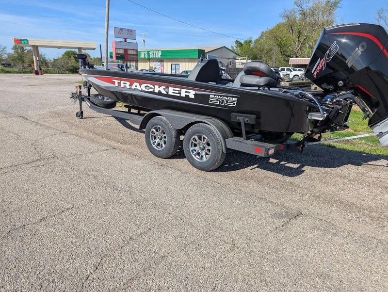 Slide: The Image of 2025 Tracker Savage 215 boat on trailer in parking lot. - 3