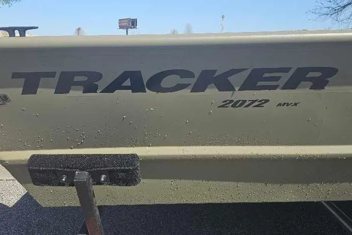 Slide: The Image of 2025 Tracker Grizzly 2072 Utility boat side view with logo and model details. - 22