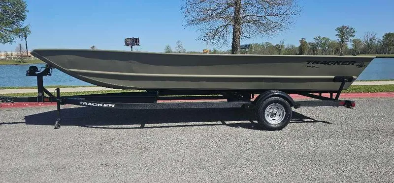 Slide: The Image of 2025 Tracker Grizzly 2072 Utility boat interior, showcasing spacious deck and durable design. - 4