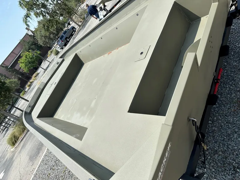 Slide: The Image of 2025 Tracker GRIZZLY 2072 Utility boat on trailer, outdoor setting. - 2