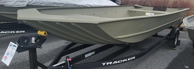 Slide: The Image of 2025 Tracker GRIZZLY 2072 Utility boat on trailer, displayed outdoors. - 2