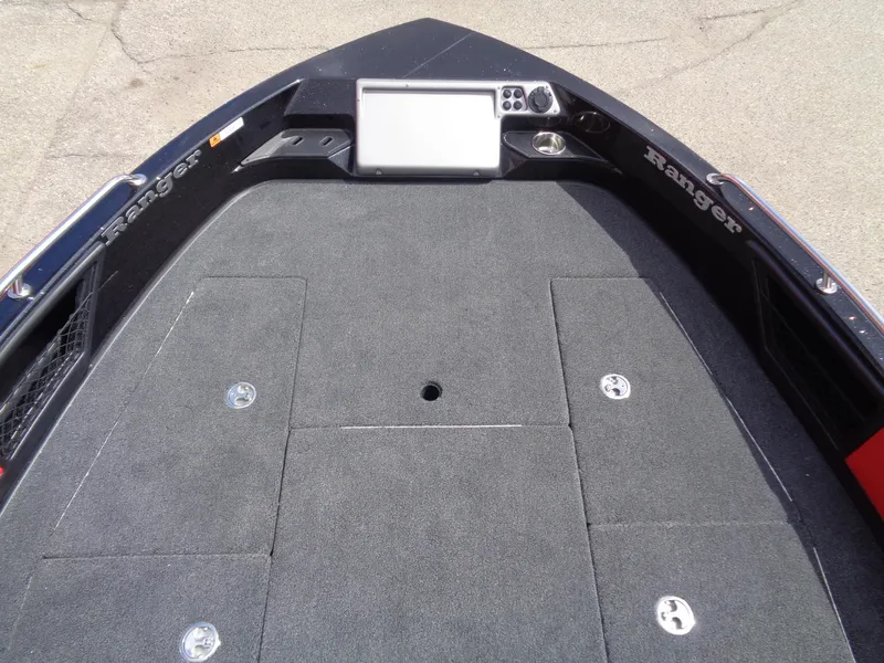 Slide: The Image of Bow of 2025 Ranger 1880MS boat with carpeted deck and control panel. - 9