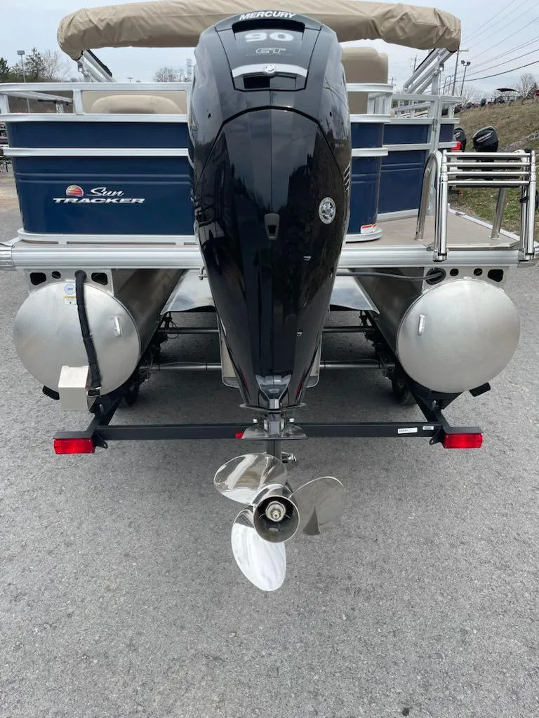 Slide: The Image of 2025 Sun Tracker Fishin' Barge 20 DLX pontoon boat with Mercury outboard motor. - 5