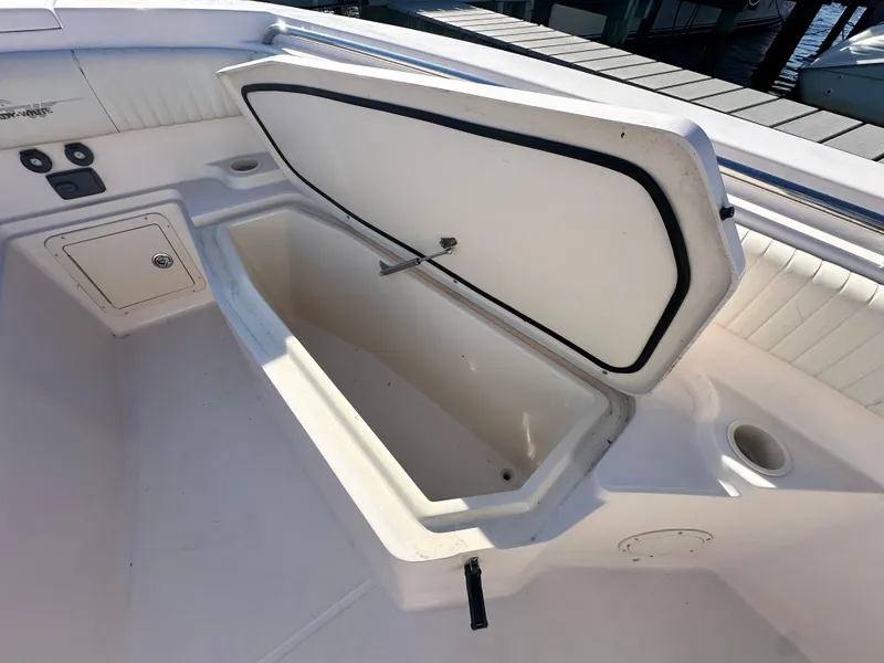 Slide: The Image of Open storage compartment on 2008 Grady-White Bimini 306 boat deck. - 11