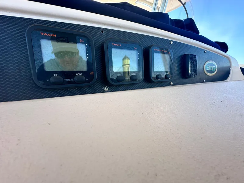 Slide: The Image of Dashboard of 2008 Grady-White Bimini 306 boat with tachometer displays. - 21