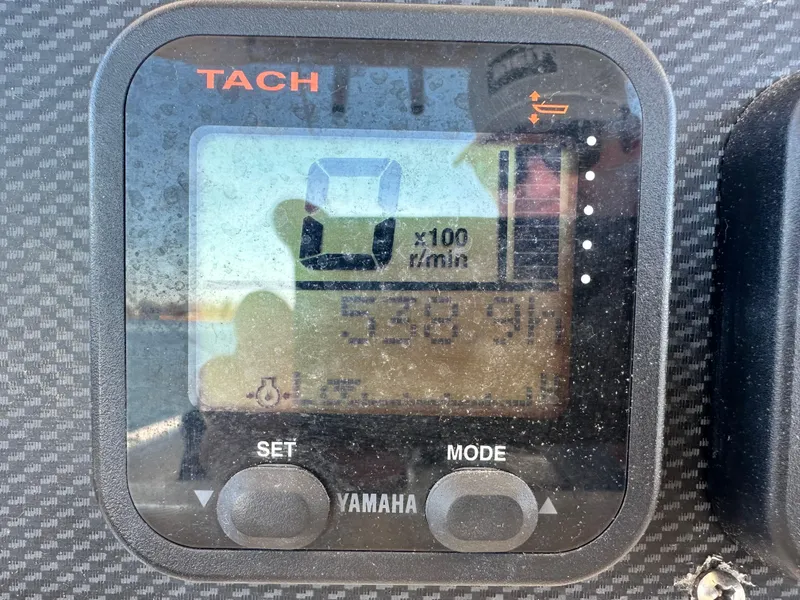 Slide: The Image of Yamaha tachometer display on 2008 Grady-White Bimini 306 boat dashboard. - 23