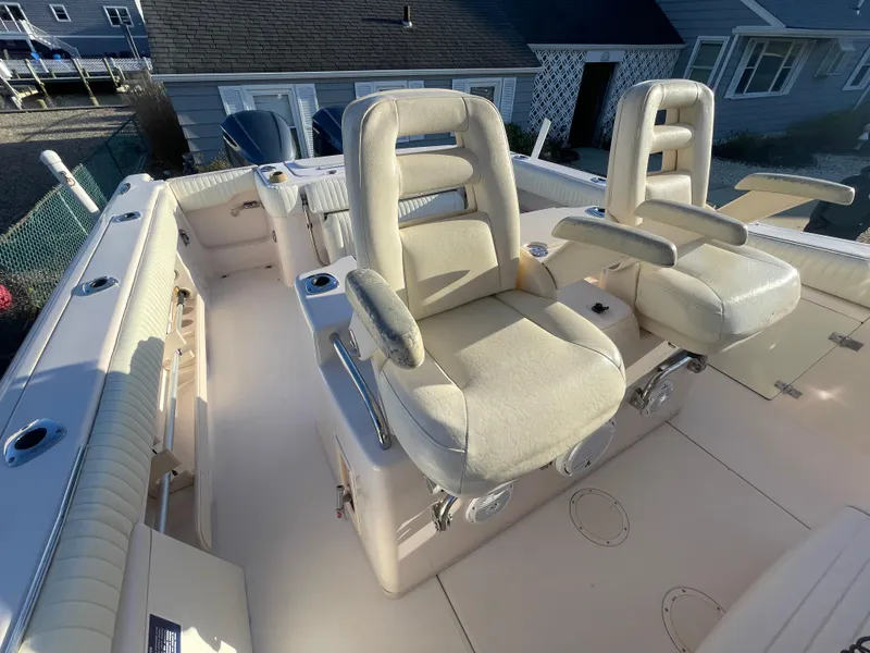 Slide: The Image of 2008 Grady-White Bimini 306 boat interior with two cushioned seats. - 25