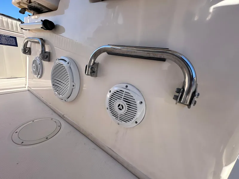 Slide: The Image of 2008 Grady-White Bimini 306 boat speakers and handrails on deck. - 27