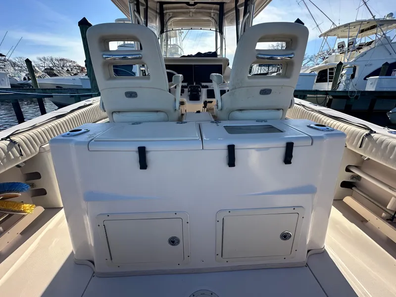 Slide: The Image of 2008 Grady-White Bimini 306 boat interior with dual seats and storage compartments. - 30