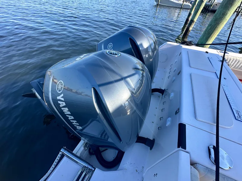 Slide: The Image of 2008 Grady-White Bimini 306 with twin Yamaha outboard engines on calm water. - 38