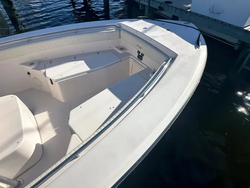 Slide: The Image of 2008 Grady-White Bimini 306 boat, white interior, docked on calm water. - 6