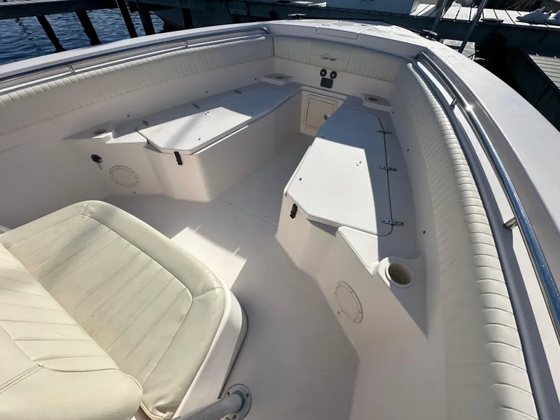 Slide: The Image of 2008 Grady-White Bimini 306 boat interior with seating and storage compartments. - 8