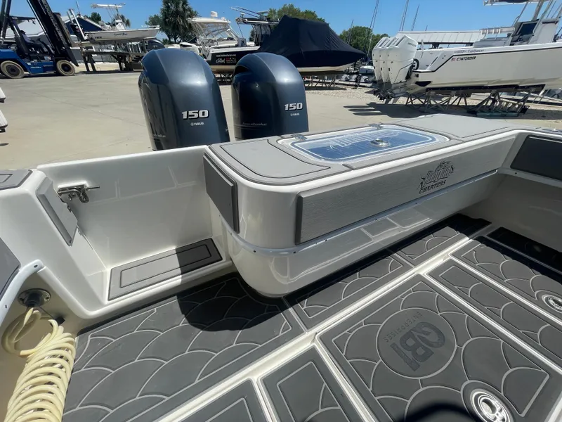 Slide: The Image of 2022 Contender 25 Tournament boat with dual 150 engines, docked in a marina. - 18