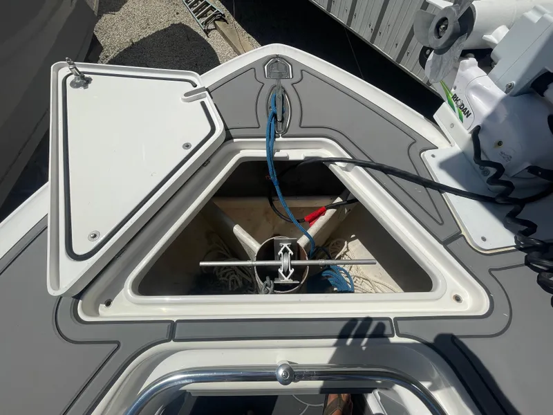 Slide: The Image of 2022 Contender 25 Tournament boat anchor storage compartment with open hatch. - 25