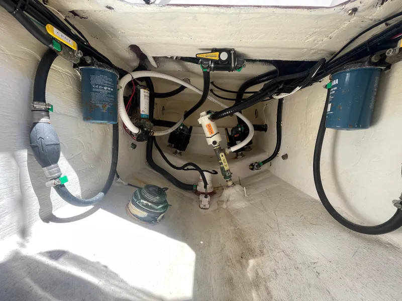 Slide: The Image of Interior view of 2022 Contender 25 Tournament boat showing wiring and components. - 27
