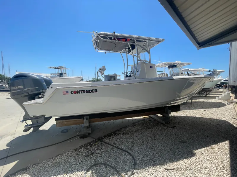 Slide: The Image of 2022 Contender 25 Tournament boat on display, featuring a sleek design and Yamaha engine. - 5