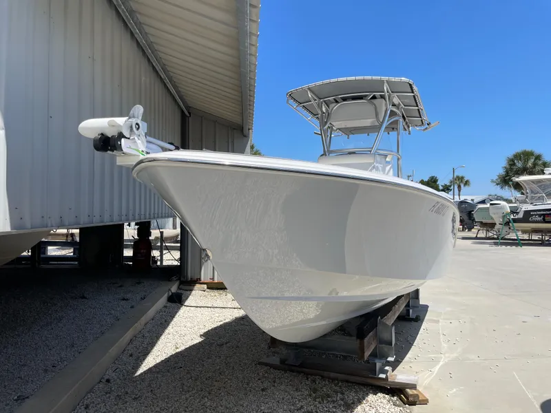 Slide: The Image of 2022 Contender 25 Tournament boat on display in a marina setting. - 6