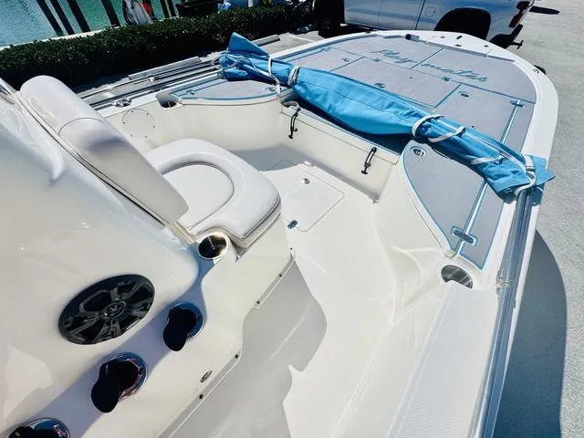 Slide: The Image of 2021 Sea Born FX24 boat interior with seating and storage, featuring a sleek design. - 13