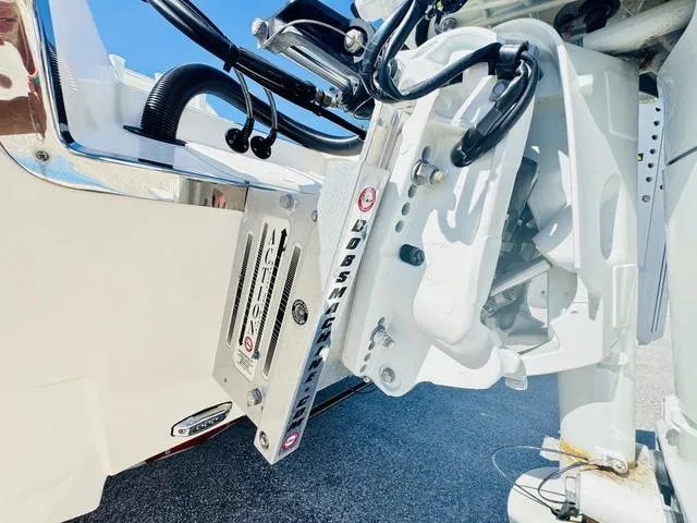 Slide: The Image of 2021 Sea Born FX24 boat engine mount with hydraulic components and cables. - 5