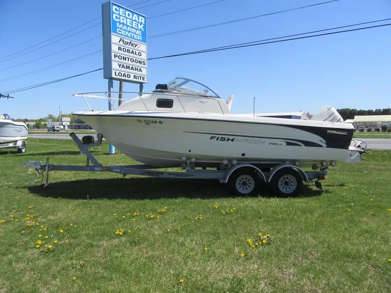 Slide: The Image of 2002 Fish Hawk 210 WA boat on trailer at Cedar Creek Marine Center. - 1