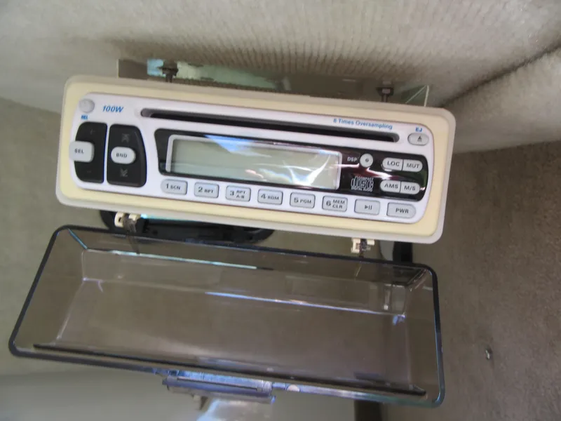 Slide: The Image of Fish Hawk 210 WA 2002 model with a mounted marine stereo system. - 24