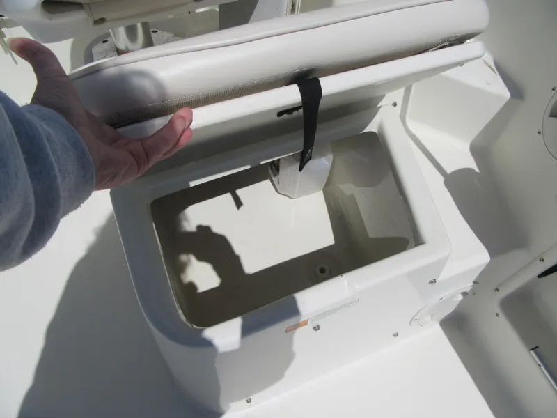 Slide: The Image of Boat storage compartment on a 2002 Fish Hawk 210 WA, with seat lifted. - 9