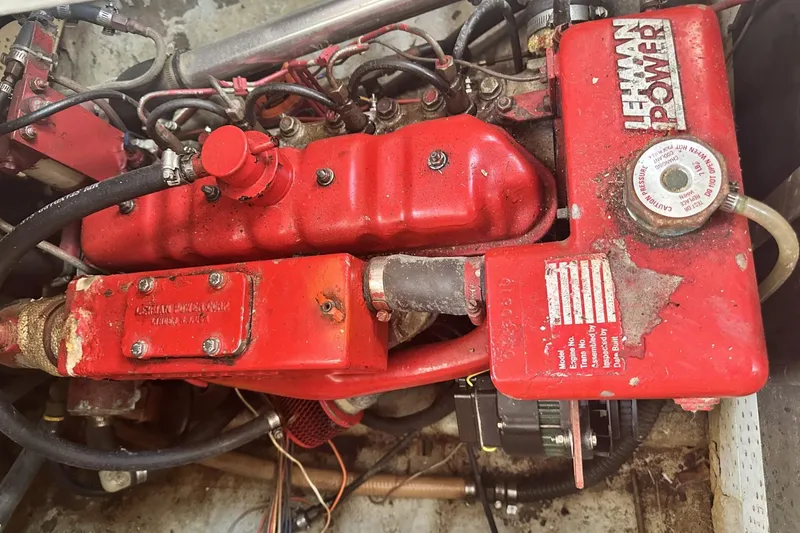 Slide: The Image of Red Lehman engine in a 1986 Slocum 43 sailboat, showcasing detailed components. - 25