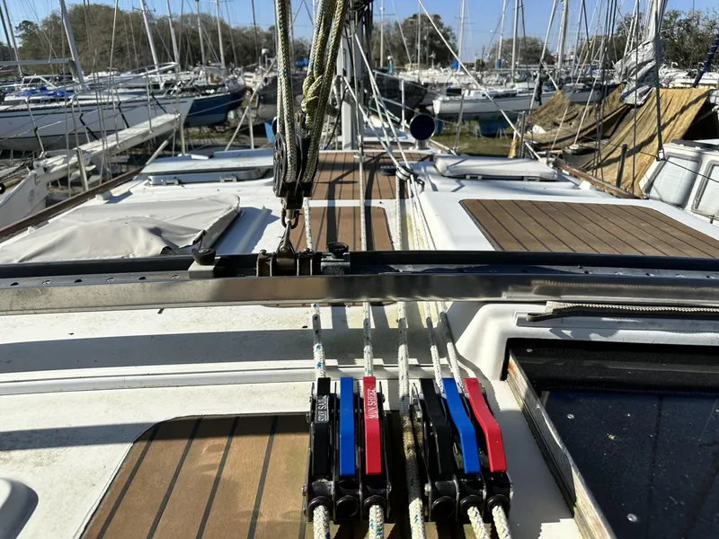 Slide: The Image of Deck view of a 1986 Slocum 43 sailboat with rigging and winches in a marina. - 30