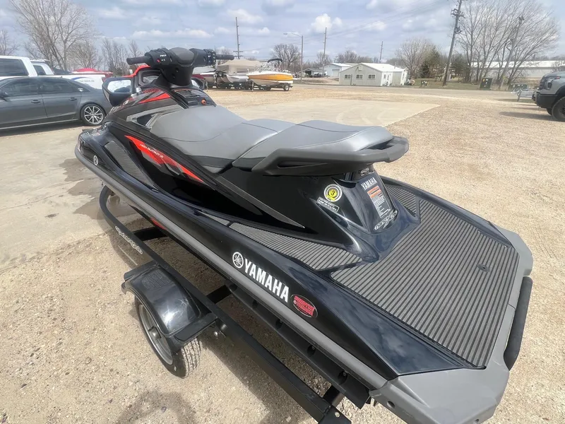 Slide: The Image of 2017 Yamaha WaveRunner VX Deluxe jet ski on a trailer, parked outdoors. - 6