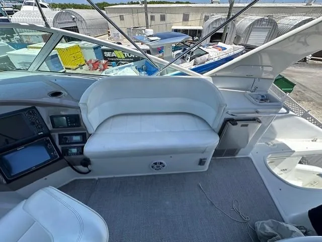 Slide: The Image of Carver 450 Voyager Pilothouse 2000, interior view with seating and controls. - 13