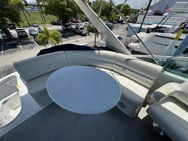 Slide: The Image of Carver 450 Voyager Pilothouse 2000 with circular seating and table on deck. - 15