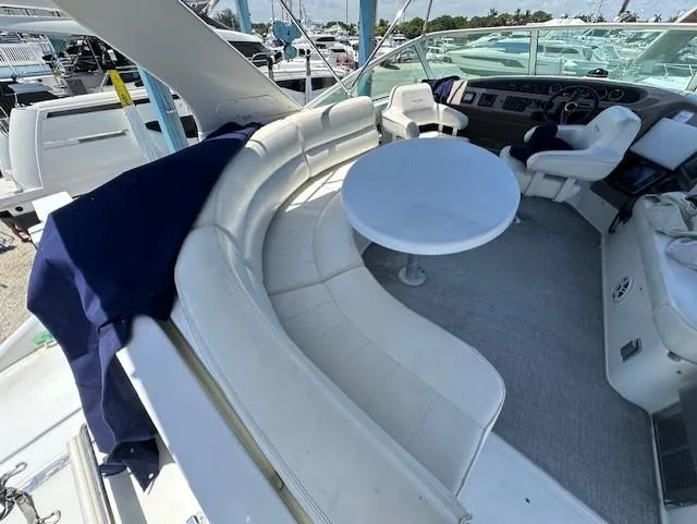 Slide: The Image of 2000 Carver 450 Voyager Pilothouse with luxurious cockpit and circular seating. - 16