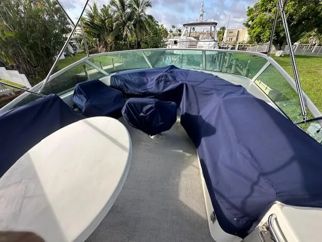 Slide: The Image of Carver 450 Voyager Pilothouse 2000 with blue covers on deck. - 18