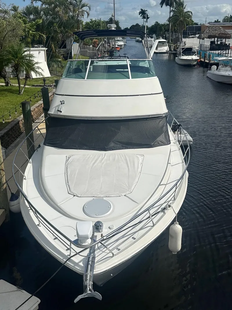 Slide: The Image of Carver 450 Voyager Pilothouse 2000 docked, sleek design. - 2