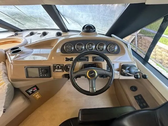 Slide: The Image of Interior view of a 2000 Carver 450 Voyager Pilothouse cockpit. - 22